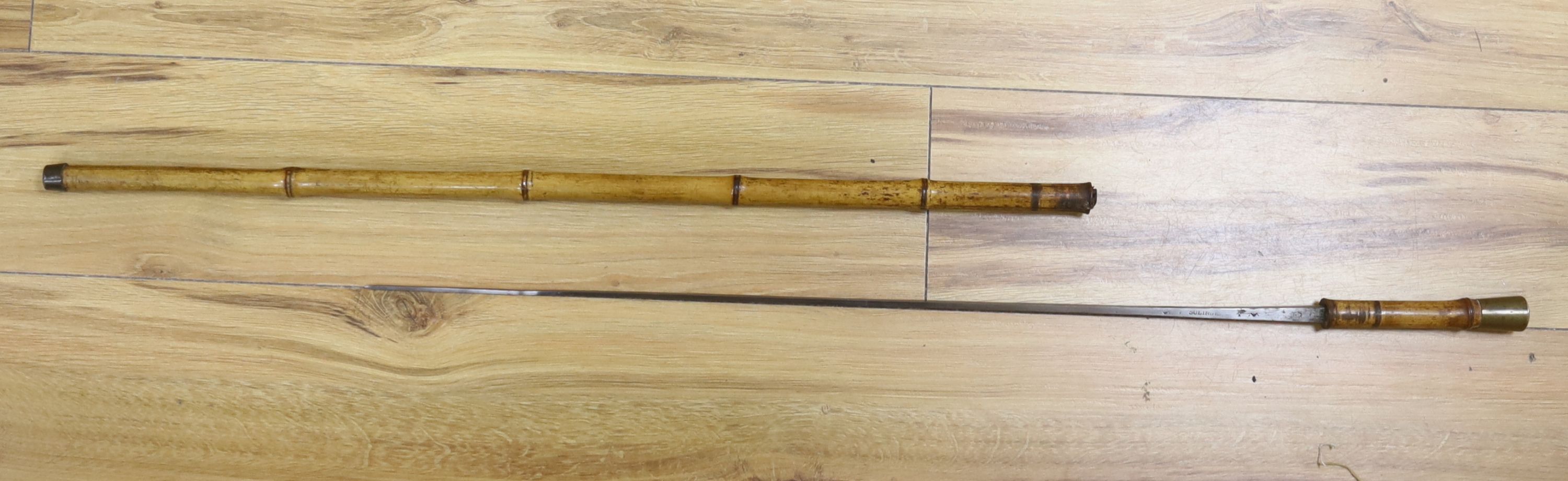 A Victorian bamboo cased swordstick, the blade stamped Solingen, 89cm long